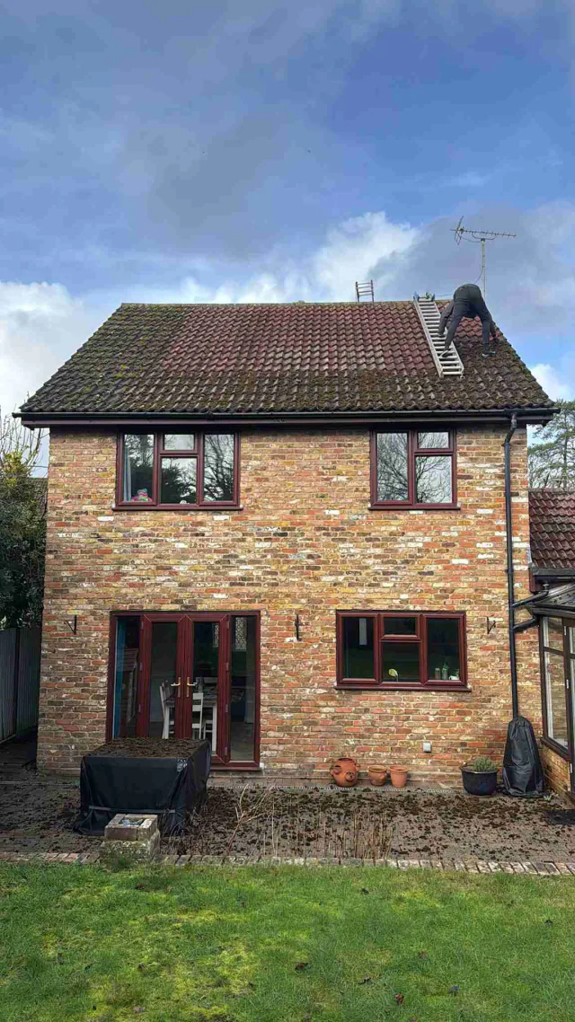 Brick house with pitched roof and chimney