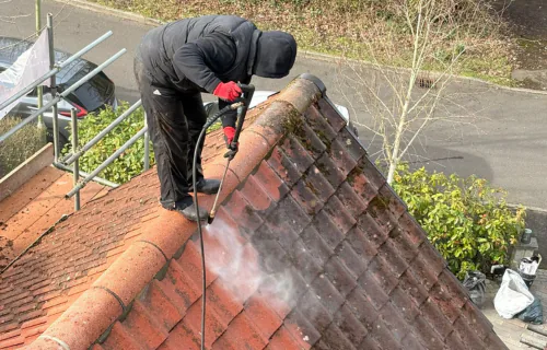 Professional roof moss removal by WWR Roofing on a residential tiled roof on the Isle of Wight