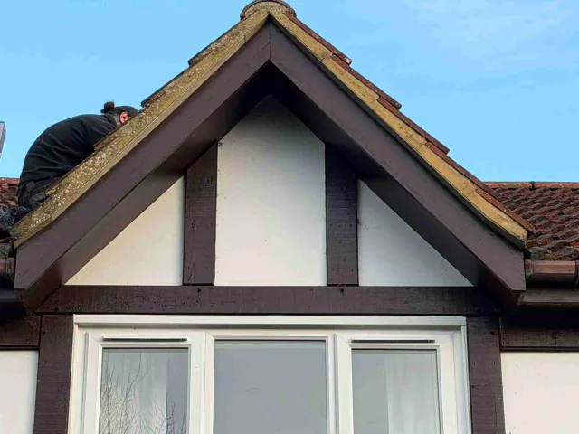 Decorative gable and roof verge above a bay window