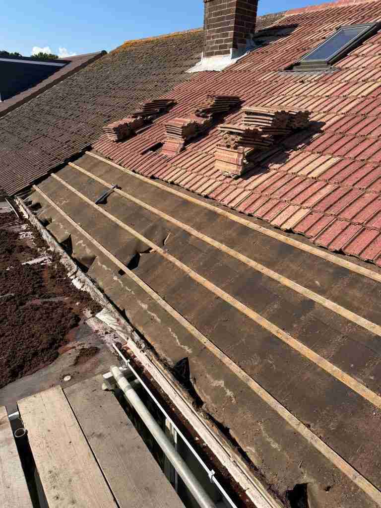 Professional roof repair in progress by WWR Roofing on a residential tiled roof on the Isle of Wight