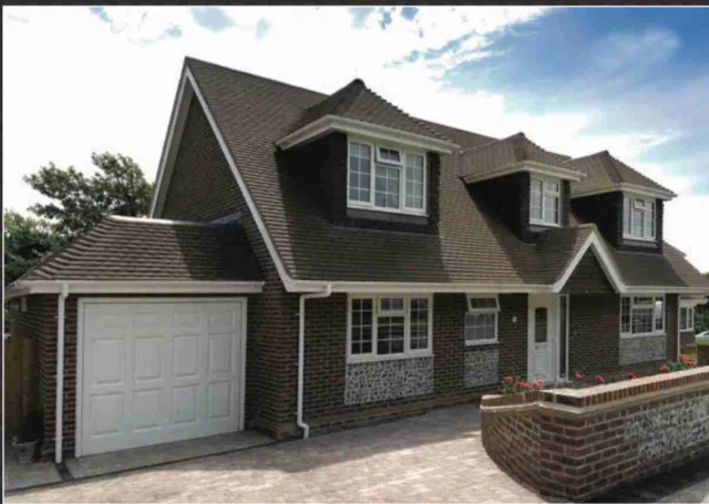 House with dormer windows and tiled roof
