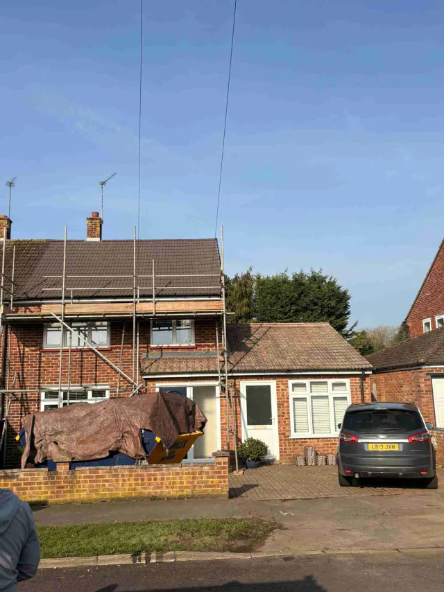 Scaffold access to a brick house roof