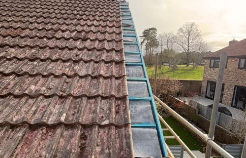 Storm damage roof repair completed by WWR Roofing on a tiled roof