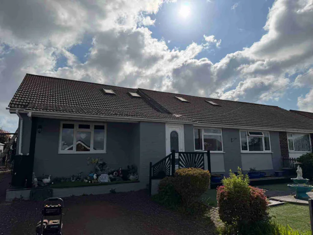 Tiled roof with ridge tiles