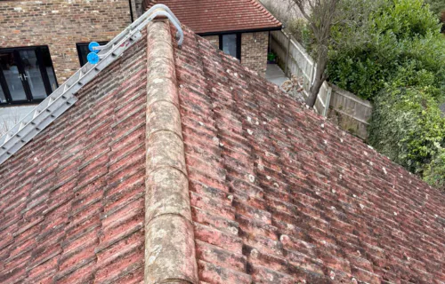 Roof inspection carried out during roof moss removal by WWR Roofing on a residential property