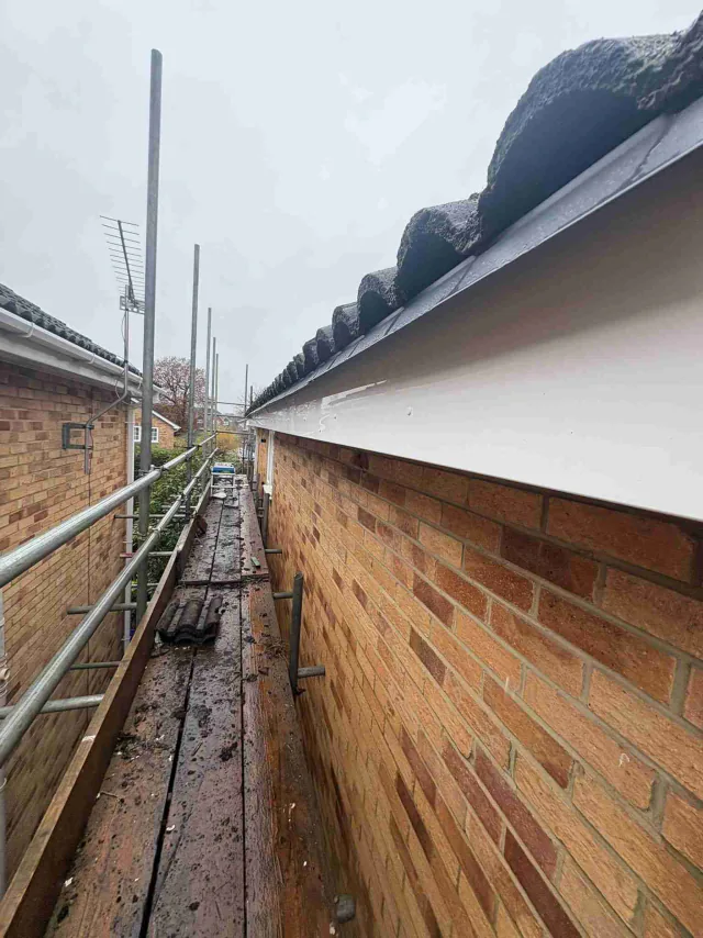 White fascia along a brick gable